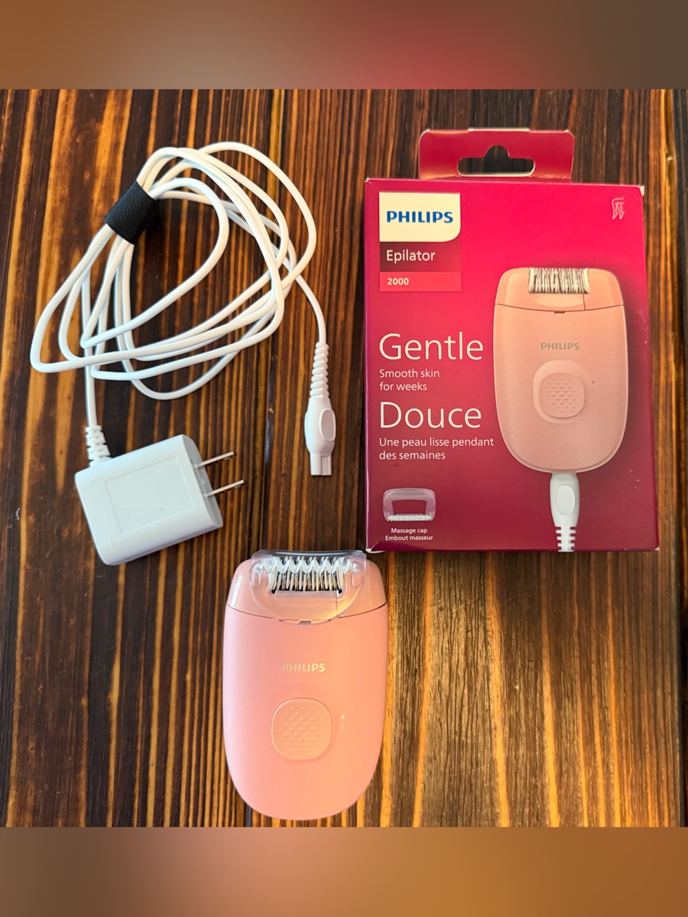 Philips pink epilator with white charger and cable